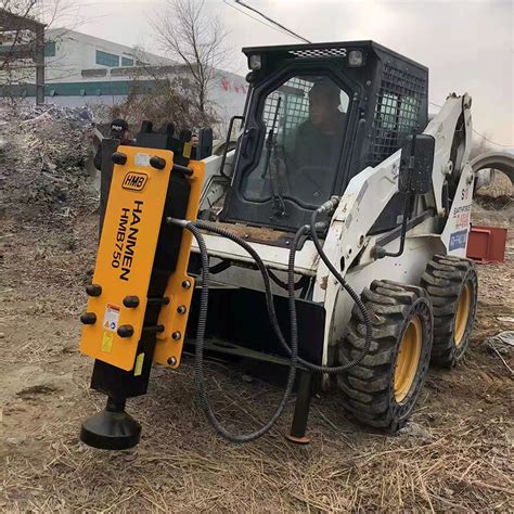 skid steer post hole driver|hydraulic post driver for skid steer.